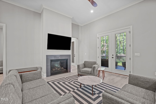 59 Mill Rd, Pittsboro, NC 27312 - living room with wood finished floors, a glass covered fireplace, crown molding, ceiling fan, and recessed lighting