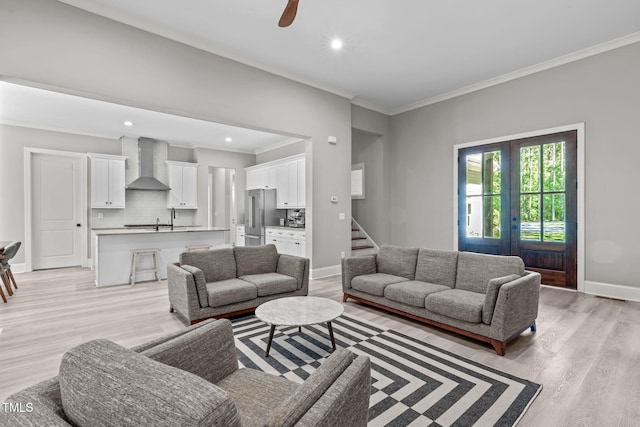 59 Mill Rd, Pittsboro, NC 27312 - living area featuring ornamental molding, light wood-style flooring, baseboards, recessed lighting, and stairway