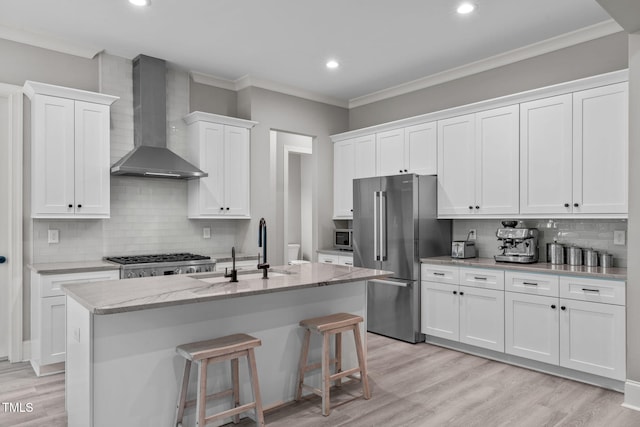 59 Mill Rd, Pittsboro, NC 27312 - kitchen featuring wall chimney range hood, appliances with stainless steel finishes, a sink, backsplash, and white cabinets