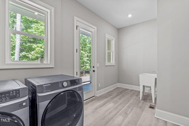 59 Mill Rd, Pittsboro, NC 27312 - washroom with independent washer and dryer, baseboards, and light wood-style flooring