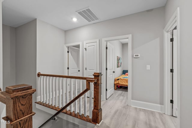 59 Mill Rd, Pittsboro, NC 27312 - corridor with an upstairs landing, light wood-style flooring, baseboards, and recessed lighting
