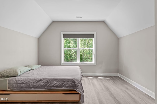 59 Mill Rd, Pittsboro, NC 27312 - bedroom featuring lofted ceiling, baseboards, and wood finished floors