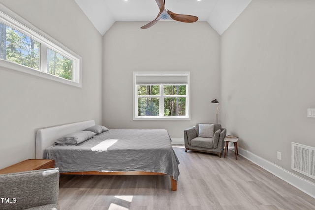 59 Mill Rd, Pittsboro, NC 27312 - bedroom with multiple windows, light wood-style flooring, a ceiling fan, and high vaulted ceiling