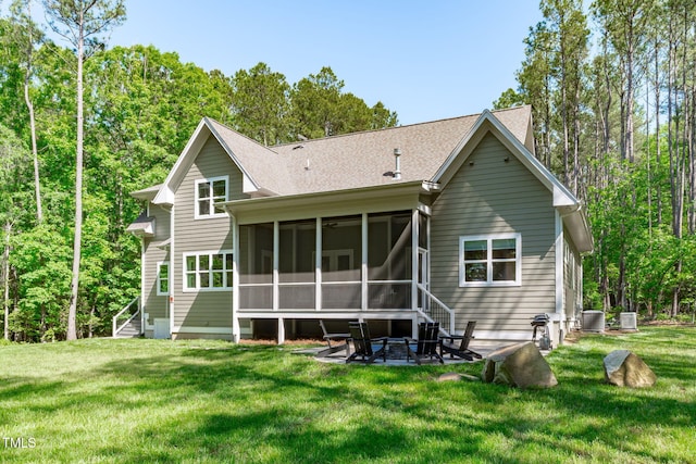 59 Mill Rd, Pittsboro, NC 27312 - back of house with a lawn, a sunroom, cooling unit, and roof with shingles