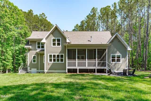 59 Mill Rd, Pittsboro, NC 27312 - back of property with a sunroom, a yard, and a shingled roof