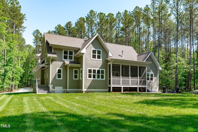 59 Mill Rd, Pittsboro, NC 27312 - back of property featuring a sunroom, a lawn, and a shingled roof