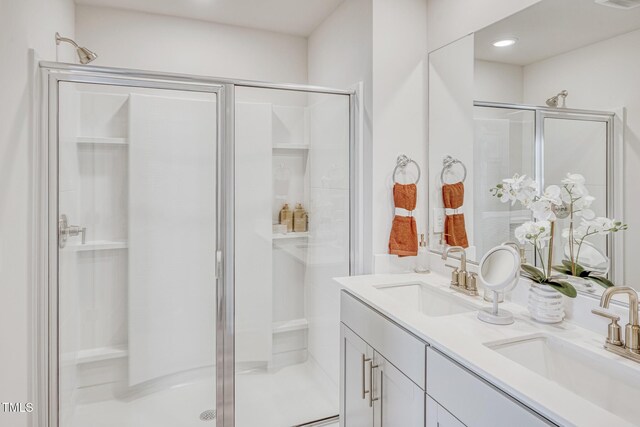 1167 Abbott St, Mebane, NC 27302 - bathroom with a stall shower, double vanity, and recessed lighting