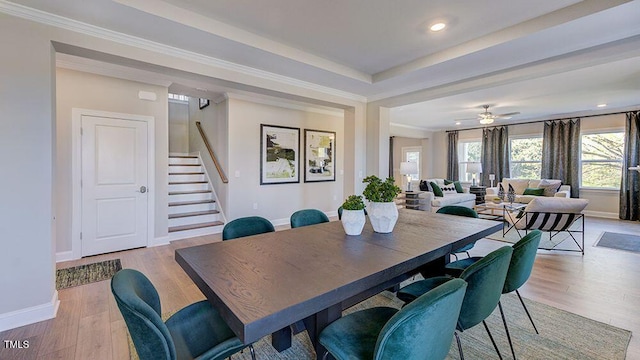 2625 Stonington Dr, Cary, NC 27523 - dining space featuring light wood-style floors, baseboards, and stairs