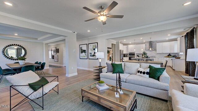 2625 Stonington Dr, Cary, NC 27523 - living room featuring baseboards, recessed lighting, a ceiling fan, and light wood-style flooring