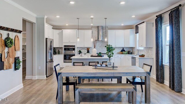 2625 Stonington Dr, Cary, NC 27523 - dining space with baseboards, ornamental molding, light wood-style flooring, and recessed lighting