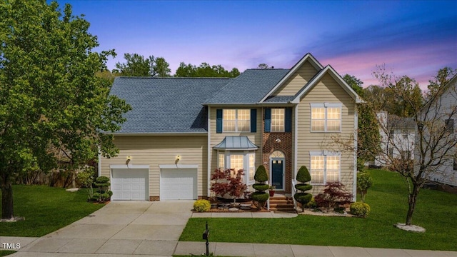 1012 Delta River Way, Knightdale, NC 27545 - view of front of house with driveway, a yard, a garage, and roof with shingles