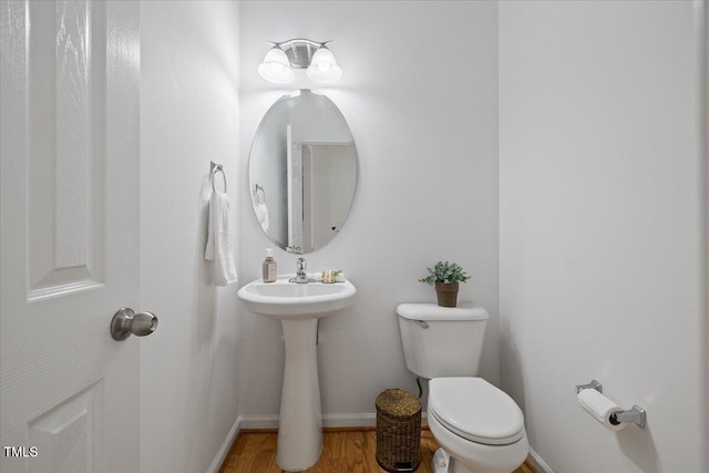 1012 Delta River Way, Knightdale, NC 27545 - bathroom featuring toilet, baseboards, and wood finished floors