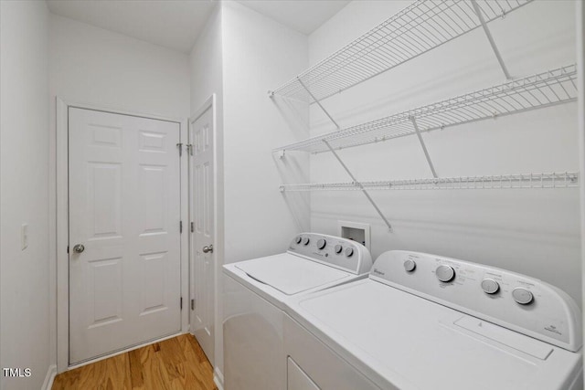 1012 Delta River Way, Knightdale, NC 27545 - washroom with washing machine and clothes dryer and light wood finished floors