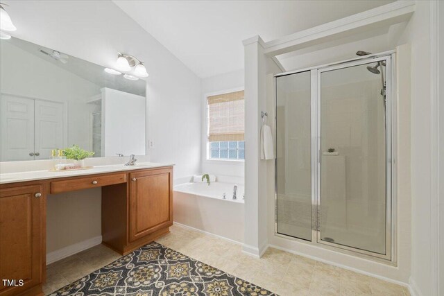 1012 Delta River Way, Knightdale, NC 27545 - full bath with lofted ceiling, a stall shower, a garden tub, double vanity, and tile patterned flooring