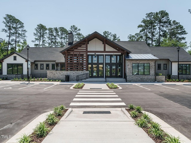 view of building exterior featuring uncovered parking