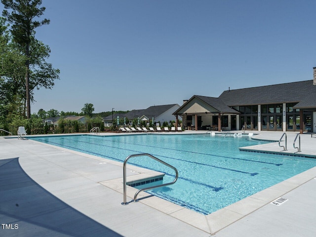 community pool featuring a patio area