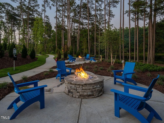 view of patio / terrace featuring an outdoor fire pit