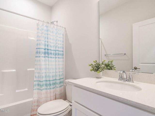 full bathroom featuring toilet, shower / bathtub combination with curtain, and vanity