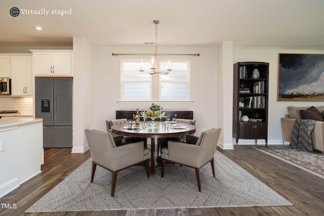dining room with recessed lighting, baseboards, a chandelier, and dark wood-style floors