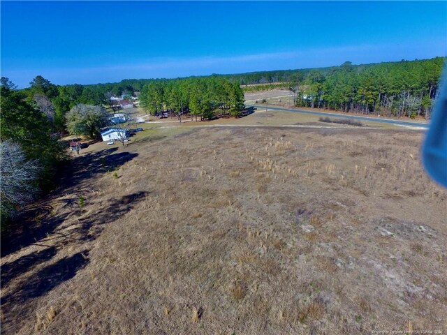 birds eye view of property featuring a rural view