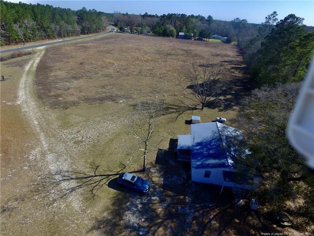 drone / aerial view with a rural view and a view of trees