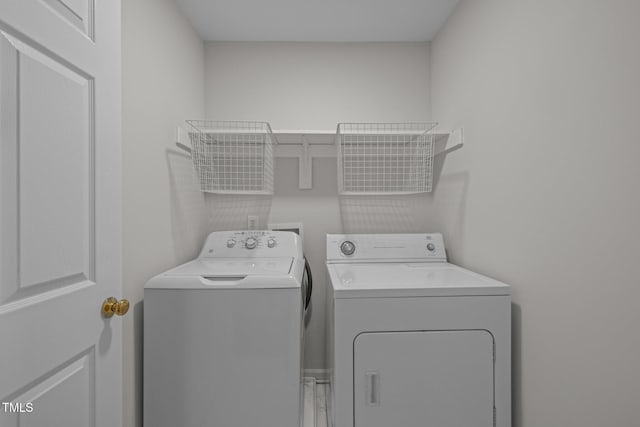 laundry area with laundry area and washing machine and clothes dryer