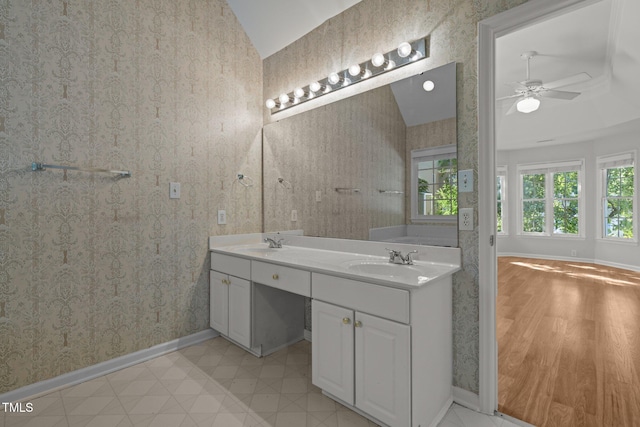 bathroom featuring a ceiling fan, baseboards, and a sink