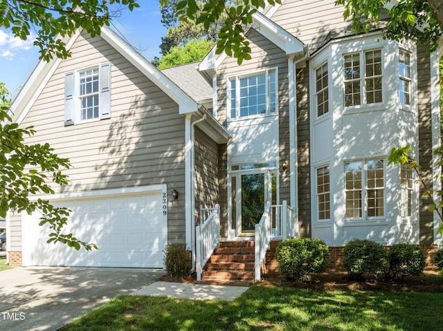 view of front facade with an attached garage and driveway
