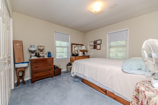 bedroom with carpet and baseboards