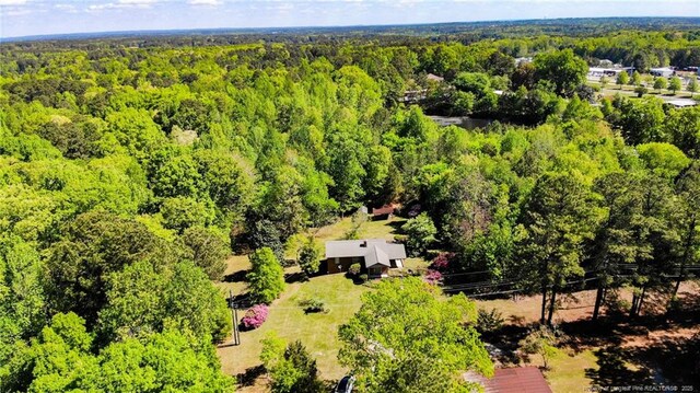 aerial view featuring a view of trees