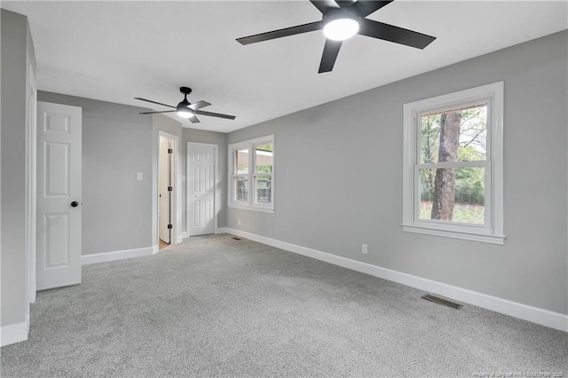 1833 Faber St, Fayetteville, NC 28304 - unfurnished bedroom with baseboards, visible vents, multiple windows, and carpet flooring