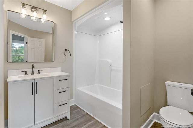 1833 Faber St, Fayetteville, NC 28304 - full bathroom with toilet, vanity, shower / bath combination, and wood finished floors