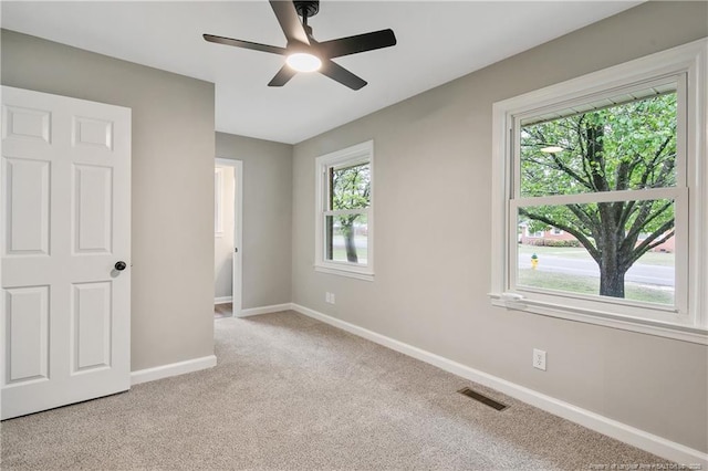 1833 Faber St, Fayetteville, NC 28304 - unfurnished bedroom featuring visible vents, carpet flooring, a ceiling fan, and baseboards