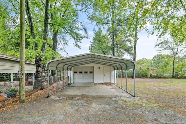 1833 Faber St, Fayetteville, NC 28304 - garage featuring a detached garage and fence