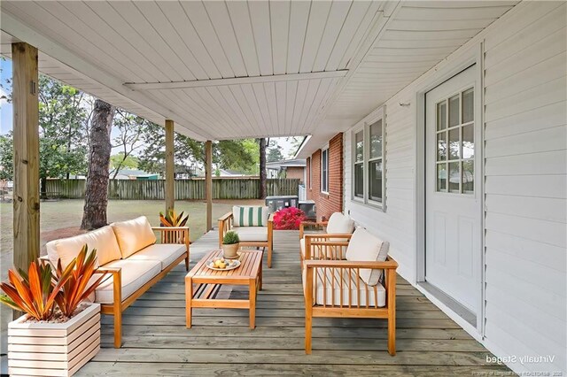 1833 Faber St, Fayetteville, NC 28304 - wooden deck featuring outdoor lounge area