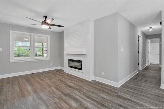 1833 Faber St, Fayetteville, NC 28304 - unfurnished living room featuring a ceiling fan, wood finished floors, and a fireplace