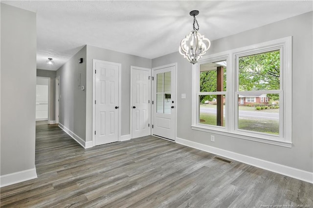 1833 Faber St, Fayetteville, NC 28304 - foyer entrance with a chandelier and wood finished floors