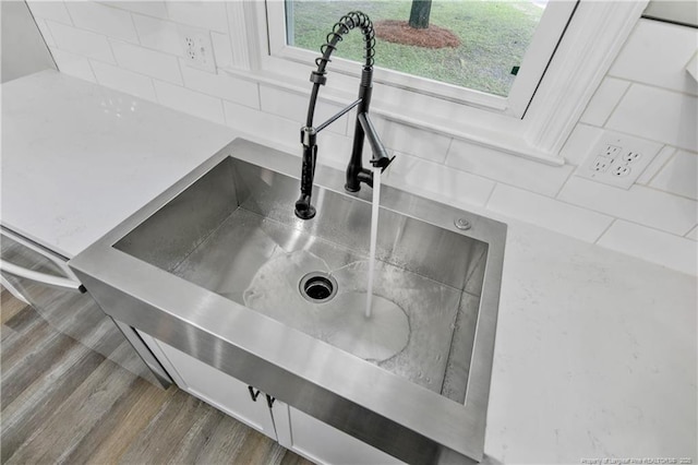 1833 Faber St, Fayetteville, NC 28304 - kitchen view of backsplash and wood finished floors