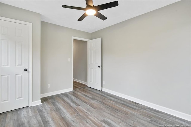 1833 Faber St, Fayetteville, NC 28304 - unfurnished bedroom with wood finished floors and ceiling fan