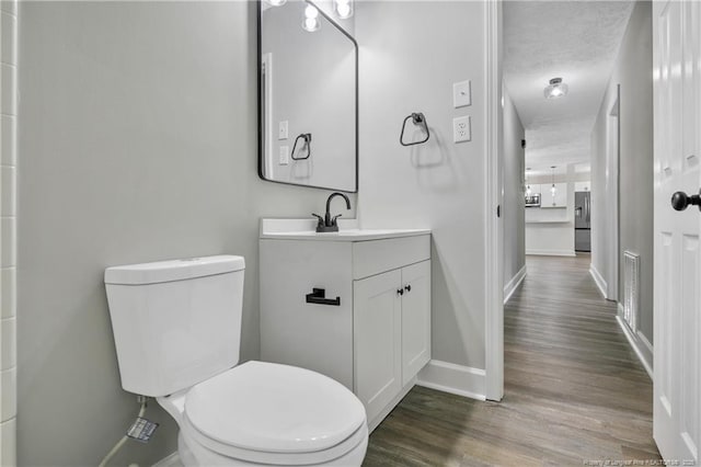 1833 Faber St, Fayetteville, NC 28304 - bathroom with wood finished floors and vanity
