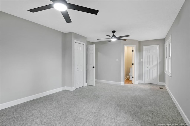 1833 Faber St, Fayetteville, NC 28304 - unfurnished bedroom with light colored carpet, ceiling fan, and ensuite bathroom