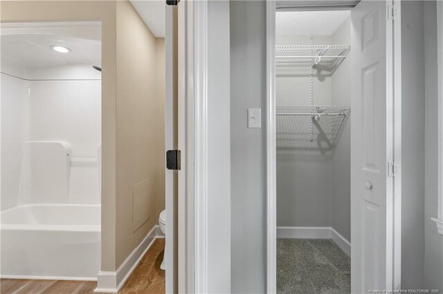 1833 Faber St, Fayetteville, NC 28304 - bathroom featuring wood finished floors and tub / shower combination