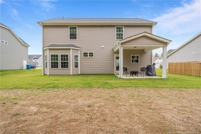 3040 Wilton Way, Vass, NC 28394 - back of house featuring a lawn, fence, and a patio area
