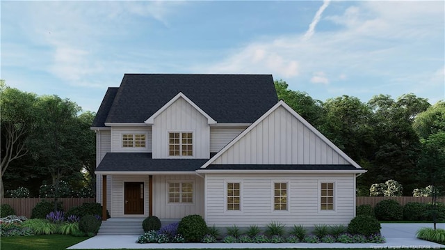 modern farmhouse style home with fence and board and batten siding
