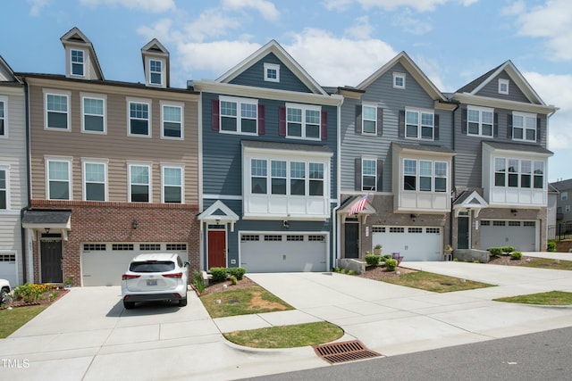 view of front of home featuring a garage, driveway, and brick siding