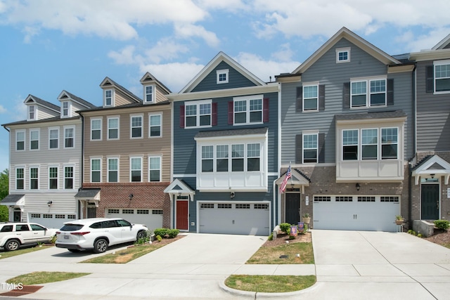 view of property featuring a garage and driveway