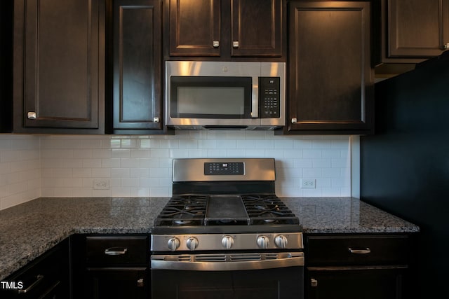 kitchen with backsplash, dark brown cabinetry, and appliances with stainless steel finishes