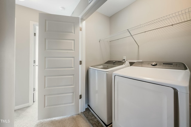 washroom with laundry area and washing machine and dryer