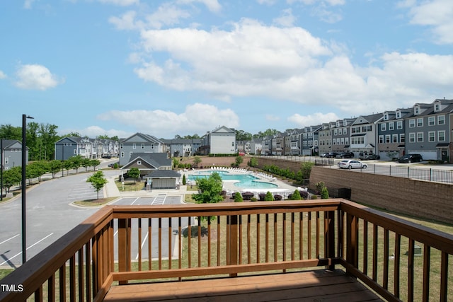 wooden terrace with a residential view