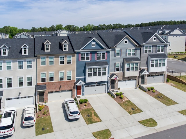 view of front facade featuring a residential view and driveway